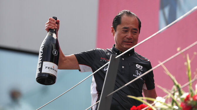 Toyoharu Tanabe holding bottle of champagne