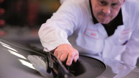 Honda technician working on a car.