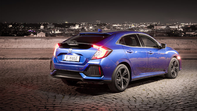 Rear three-quarter facing Honda Civic 5 door.