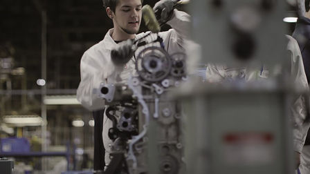 Honda technician working on an engine.