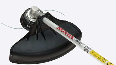 Honda Backpack Brushcutters, close up of Versatool with brushcutter attachment.