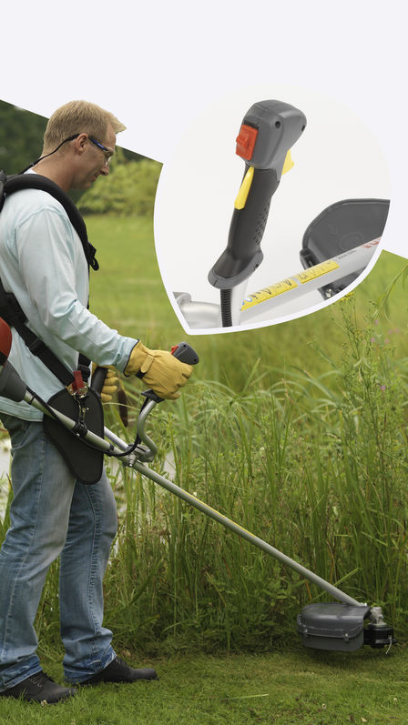 Brushcutter being used by model, focusing on adjustable handles, garden location.