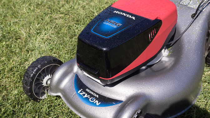 Close up of Honda izy-On lawnmower in garden location.