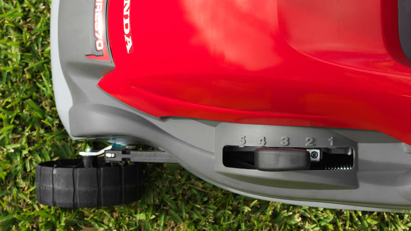 Honda HRE lawnmower, close up of deck height adjustment handle.