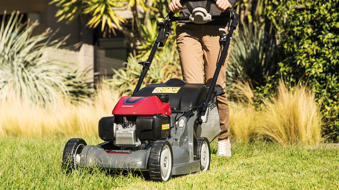 Front facing shot of Honda HRX lawnmower in garden location.