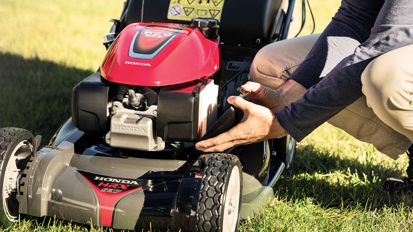 Honda HRX lawnmower hands on close up.