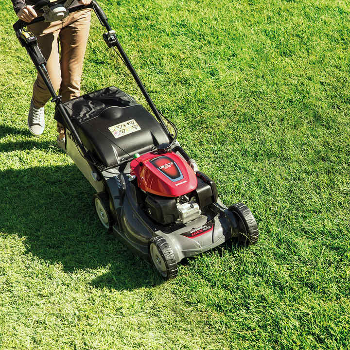 Honda HRX lawnmower front three quarters facing in garden location.