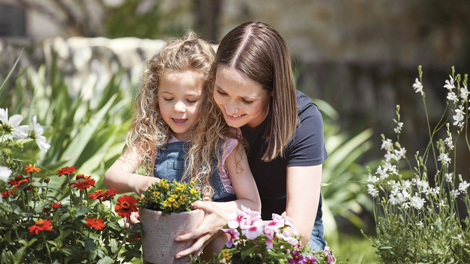Woman and kid with plants