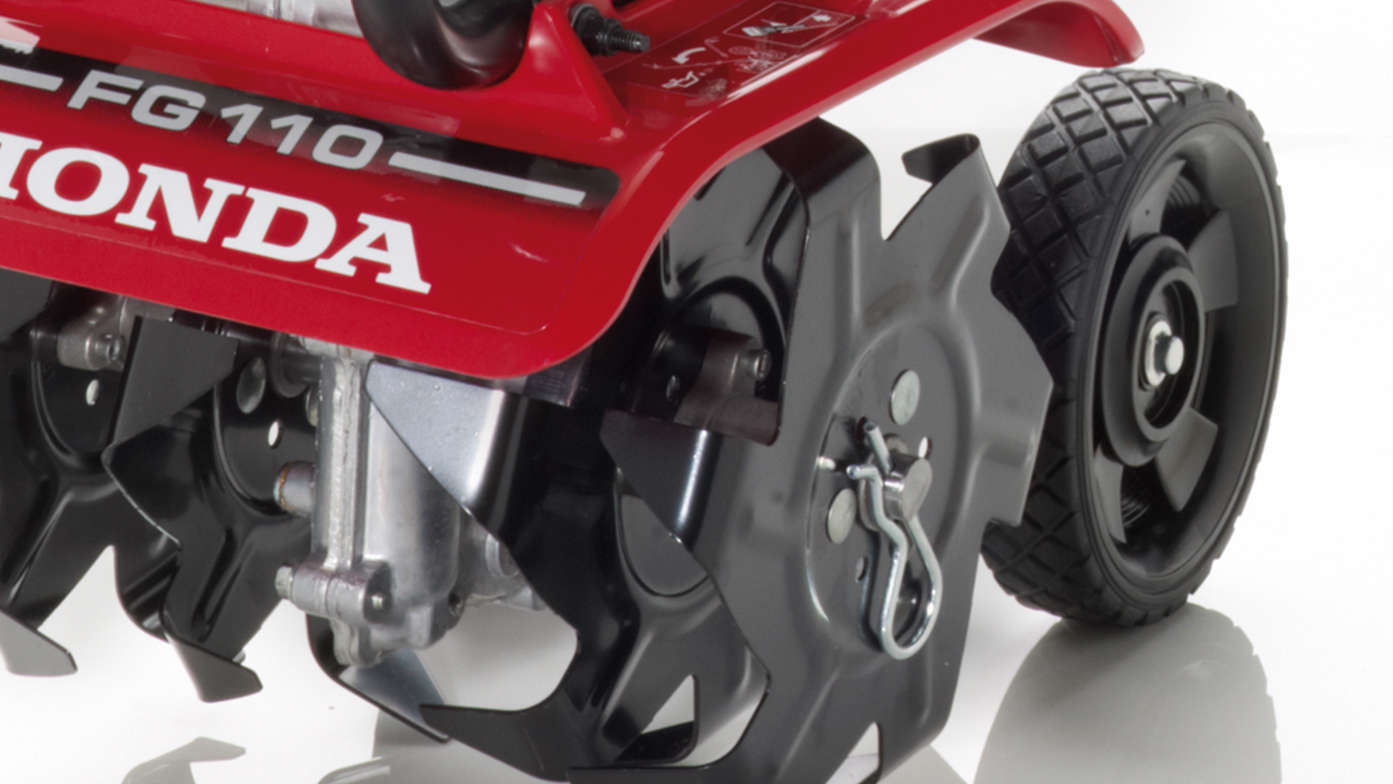 Honda microtillers, close up, focusing on wheels.