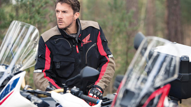 Close-up of man wearing black Honda Spidi Adventure Jacket