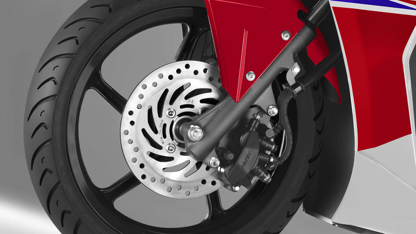Honda NSC50R scooter front wheel focusing on CBS brakes. 