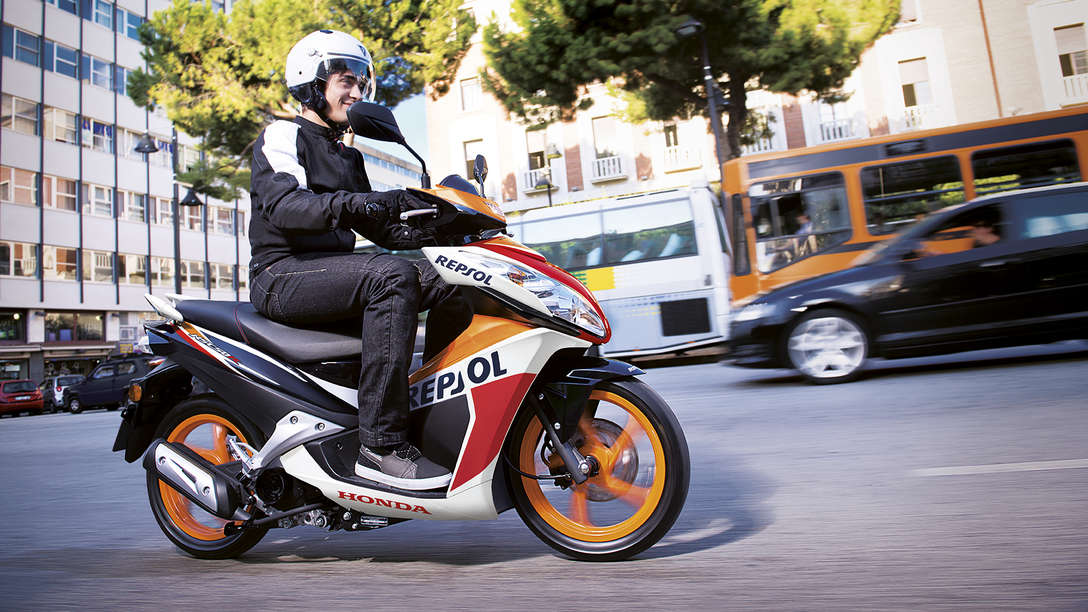 NSC50R side view with rider. Right-facing (Road location).