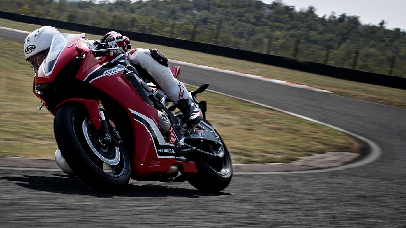 Front three-quarter facing Honda CBR1000RR on race track.