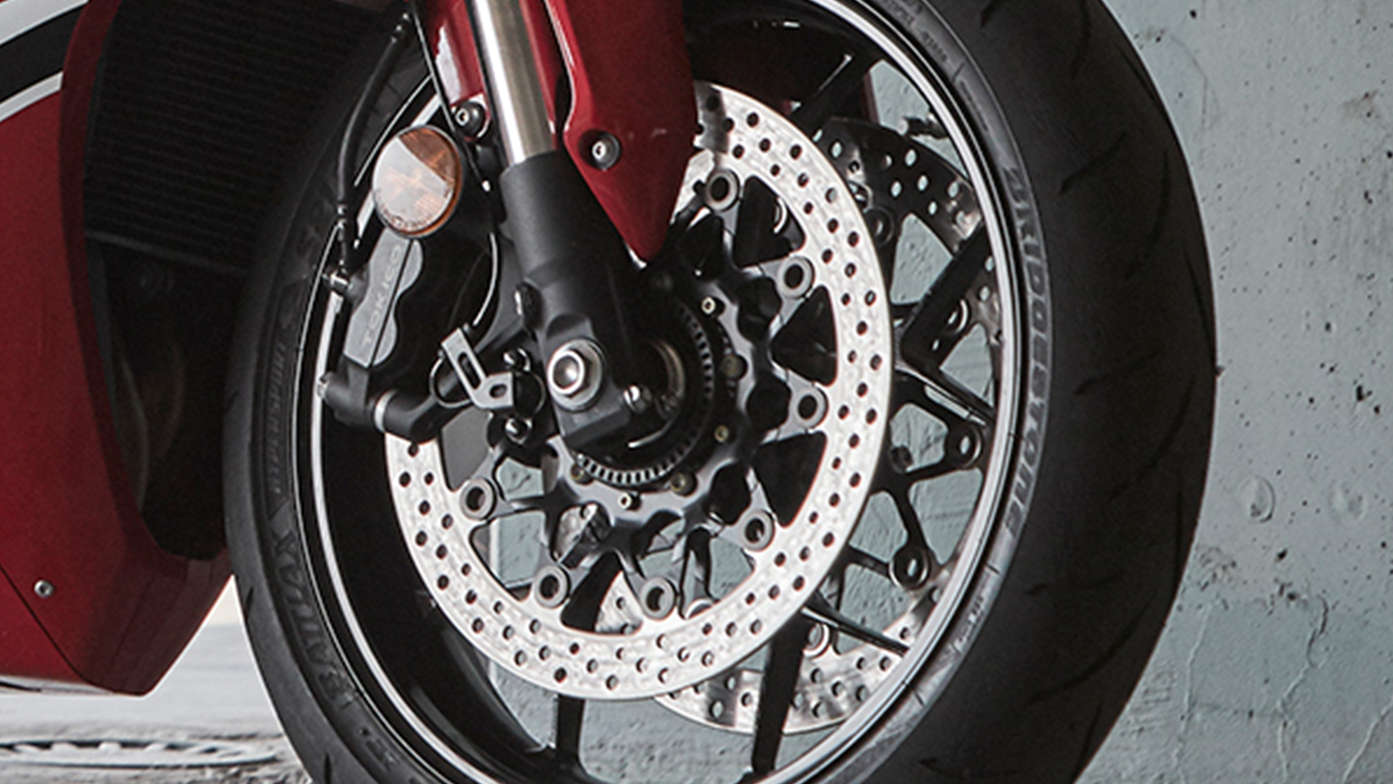 Close up shot of Honda CBR1000RR wheel and brakes.