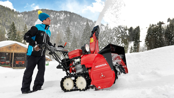Snowthrower side facing, in use by model.