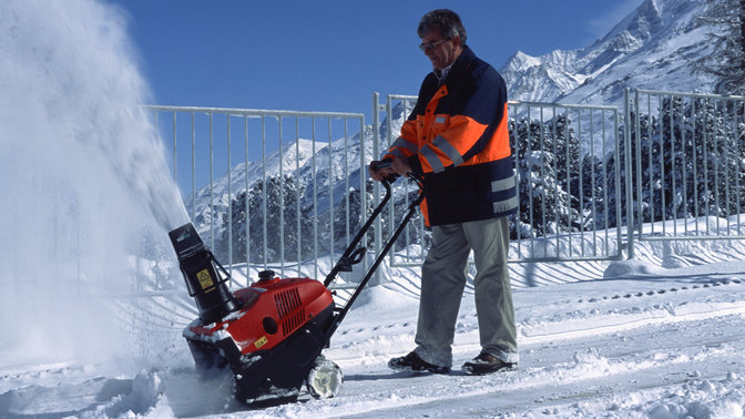 Single-stage being used by model, mountain location.