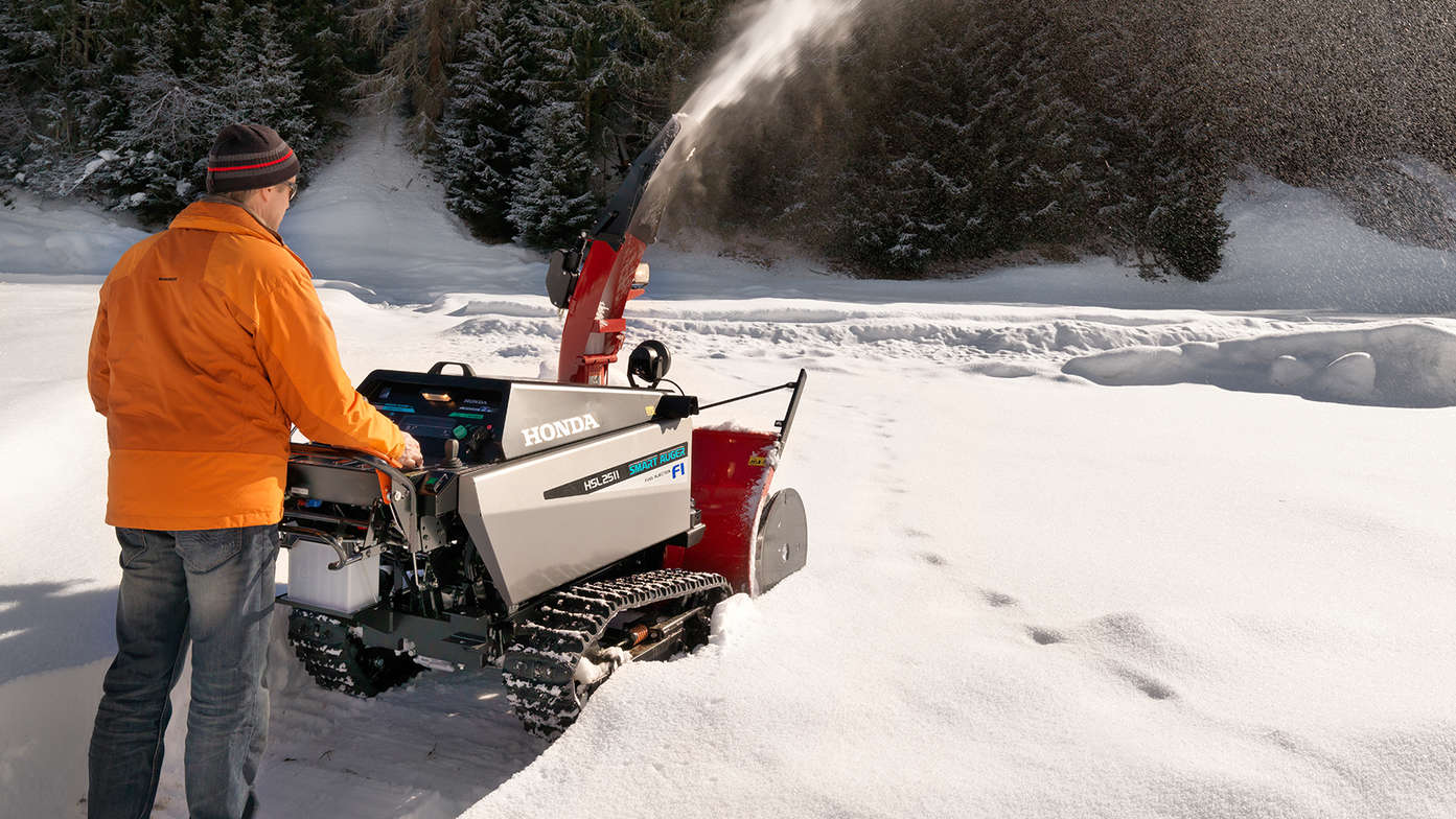 snowthrower being used in snow