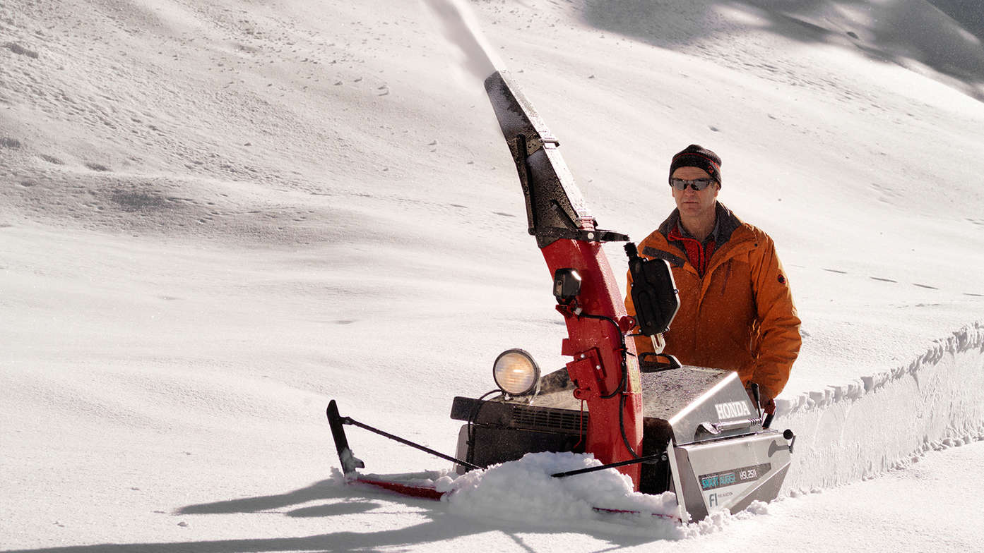person using snowthrower