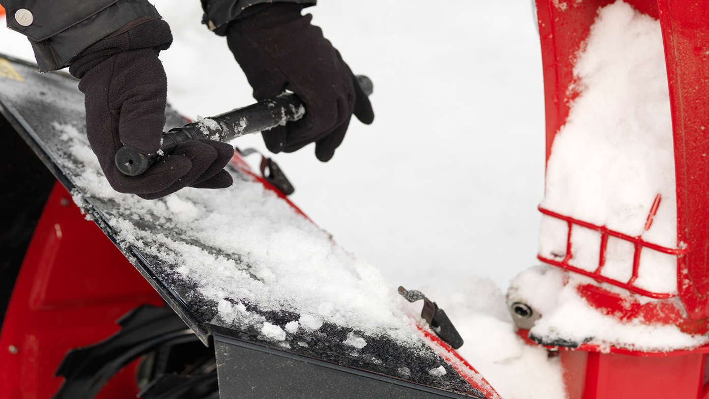 person clearing chute
