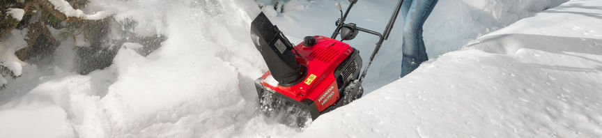 Snowthrower being used by model, snow location.