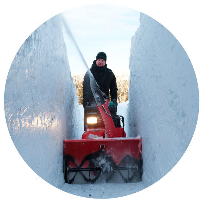 Snowthrower being used by model, snow location.